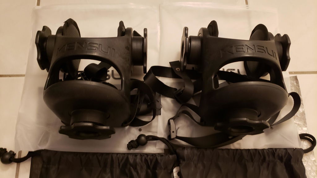 Two plate-loaded training boots on a floor