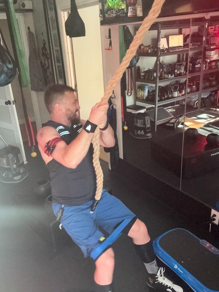 Rope pulls performed in a garage gym