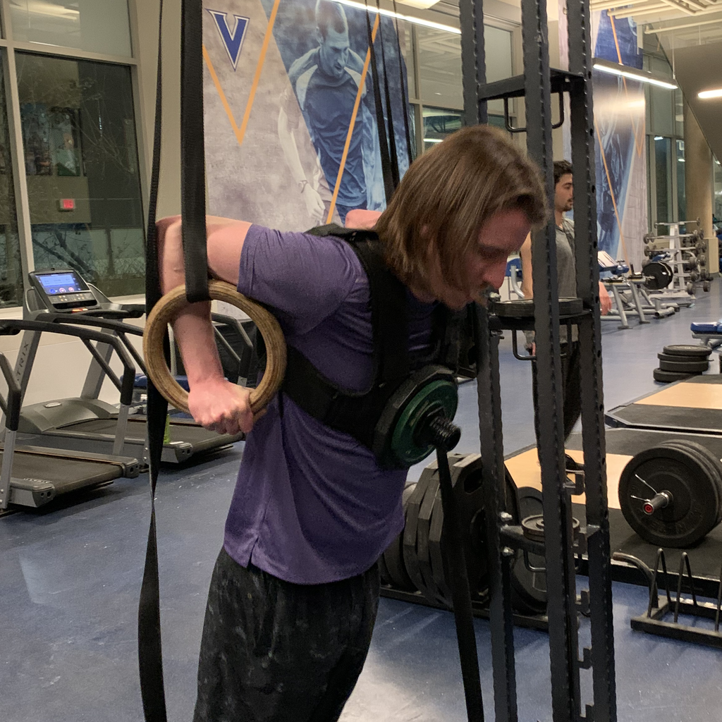 Ring dip performed in a loaded weight vest