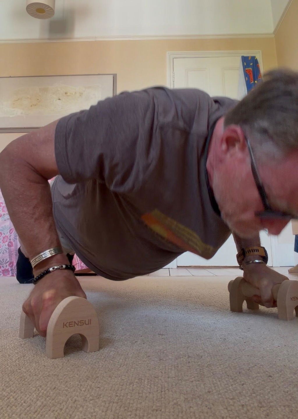 Push-up performed on wooden parallettes