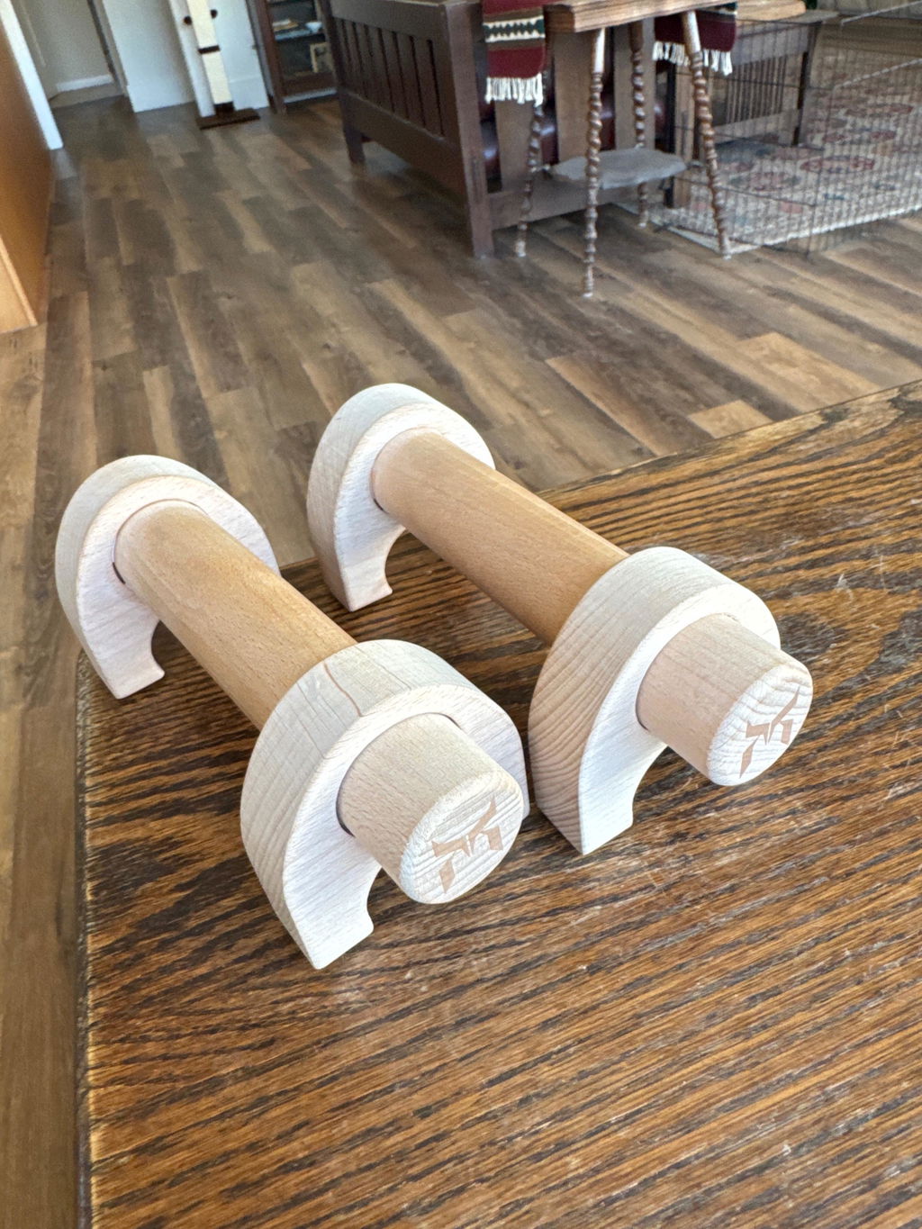 Wooden parallettes on a wood floor